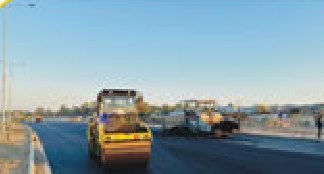 Roller compacting a new asphalt carriageway